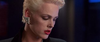 Movie still from “Beverly Hills Cop II” (1987), directed by Tony Scott – A person with short blonde hair; Close Up shot, Low angle