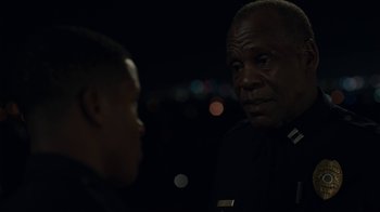 Movie still from “Beyond the Lights” (2014), directed by Gina Prince-Bythewood – Two men talking to each other in a dark room; Close Up shot, Over the shoulder angle
