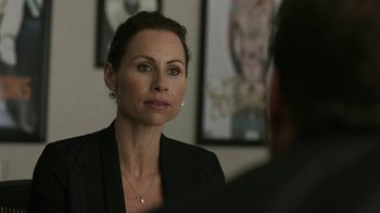 Movie still from “Beyond the Lights” (2014), directed by Gina Prince-Bythewood – A person sitting in a room; Close Up shot, Over the shoulder angle