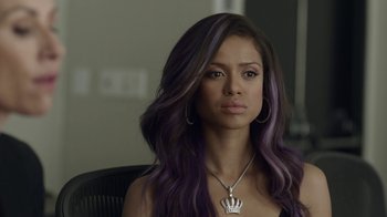 Movie still from “Beyond the Lights” (2014), directed by Gina Prince-Bythewood – A woman sitting in a chair with purple hair; Close Up shot, Over the shoulder angle