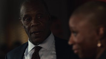 Movie still from “Beyond the Lights” (2014), directed by Gina Prince-Bythewood – A man in a suit and tie next to another man in a suit and tie; Close Up shot, Over the shoulder angle