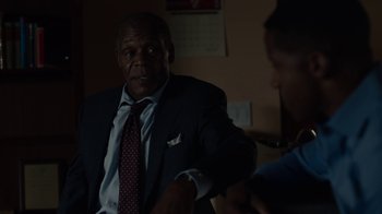 Movie still from “Beyond the Lights” (2014), directed by Gina Prince-Bythewood – An older man wearing a suit and tie talking to a young man; Close Up shot, Over the shoulder angle