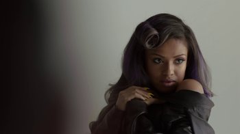 Movie still from “Beyond the Lights” (2014), directed by Gina Prince-Bythewood – A beautiful young woman with a black leather jacket; Close Up shot, Over the shoulder angle