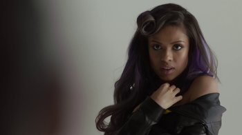Movie still from “Beyond the Lights” (2014), directed by Gina Prince-Bythewood – A beautiful young woman with long purple hair; Close Up shot, Over the shoulder angle