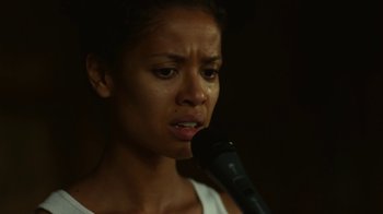 Movie still from “Beyond the Lights” (2014), directed by Gina Prince-Bythewood – A woman is crying while speaking into a microphone; Close Up shot, Low angle
