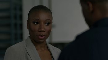 Movie still from “Beyond the Lights” (2014), directed by Gina Prince-Bythewood – A woman with a shaved head is standing next to a man; Close Up shot, Over the shoulder angle