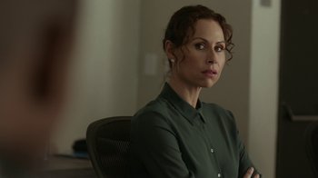 Movie still from “Beyond the Lights” (2014), directed by Gina Prince-Bythewood – A woman sitting in an office chair in front of a window; Close Up shot, Over the shoulder angle