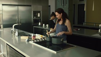 Movie still from “Beyond the Lights” (2014), directed by Gina Prince-Bythewood – Two women are cooking in the kitchen together; Medium shot, Low angle