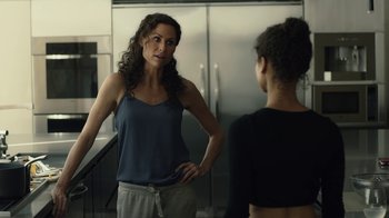 Movie still from “Beyond the Lights” (2014), directed by Gina Prince-Bythewood – A woman standing in front of a mirror talking to another woman; Medium shot, Over the shoulder angle