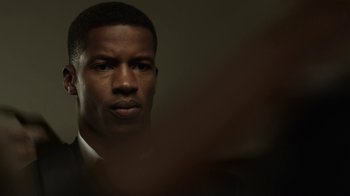 Movie still from “Beyond the Lights” (2014), directed by Gina Prince-Bythewood – A person wearing a suit and tie; Close Up shot, Over the shoulder angle