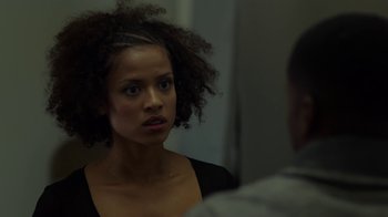 Movie still from “Beyond the Lights” (2014), directed by Gina Prince-Bythewood – A woman with curly hair looking into a mirror; Close Up shot, Over the shoulder angle