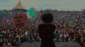 Movie still from “Beyond the Lights” (2014), directed by Gina Prince-Bythewood – A crowd of people are gathered in front of a stage; Wide shot, Low angle