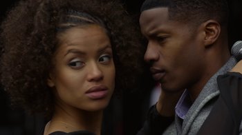 Movie still from “Beyond the Lights” (2014), directed by Gina Prince-Bythewood – A man and a woman looking at one another; Close Up shot, Over the shoulder angle