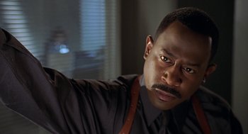 Movie still from “Big Momma's House” (2000), directed by Raja Gosnell – A person with a beard and a mustache; Close Up shot, Low angle