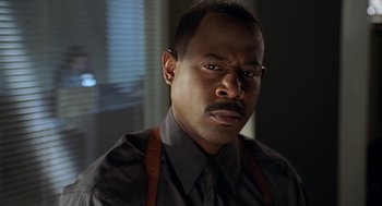 Movie still from “Big Momma's House” (2000), directed by Raja Gosnell – A person wearing a shirt and a tie; Close Up shot, Low angle