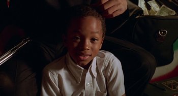 Movie still from “Big Momma's House” (2000), directed by Raja Gosnell – A young boy sitting in front of an older man; Close Up shot, High angle