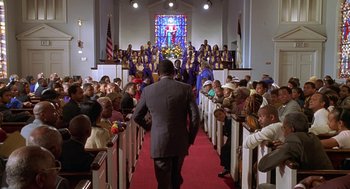 Movie still from “Big Momma's House” (2000), directed by Raja Gosnell – A group of people standing in front of a church; Extreme Wide shot, High angle