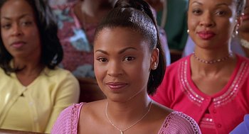 Movie still from “Big Momma's House” (2000), directed by Raja Gosnell – A person wearing a pink shirt; Close Up shot, Over the shoulder angle