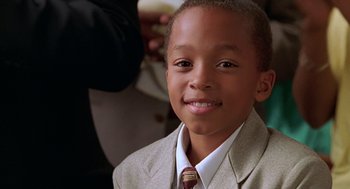 Movie still from “Big Momma's House” (2000), directed by Raja Gosnell – A person wearing a suit and a tie; Close Up shot, High angle