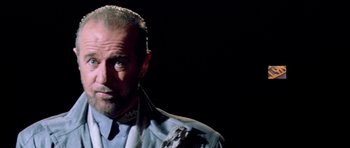 Movie still from “Bill & Ted's Excellent Adventure” (1989), directed by Stephen Herek – A person wearing a suit and tie; Close Up shot, Over the shoulder angle