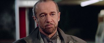 Movie still from “Bill & Ted's Excellent Adventure” (1989), directed by Stephen Herek – A person wearing a suit and tie; Close Up shot, Over the shoulder angle