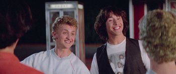 Movie still from “Bill & Ted's Excellent Adventure” (1989), directed by Stephen Herek – A couple of men standing next to each other; Medium shot, Low angle