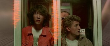 Movie still from “Bill & Ted's Excellent Adventure” (1989), directed by Stephen Herek – A group of young men standing next to each other; Medium shot, Over the shoulder angle