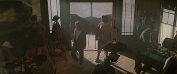 Movie still from “Bill & Ted's Excellent Adventure” (1989), directed by Stephen Herek – Two people are standing in a room with a lamp; Wide shot, High angle