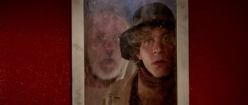 Movie still from “Bill & Ted's Excellent Adventure” (1989), directed by Stephen Herek – A man and a woman looking through a window; Close Up shot, Low angle