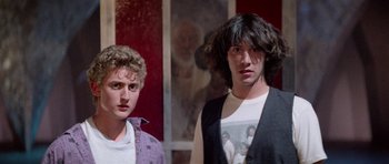 Movie still from “Bill & Ted's Excellent Adventure” (1989), directed by Stephen Herek – A couple of men standing next to each other; Medium shot, Low angle