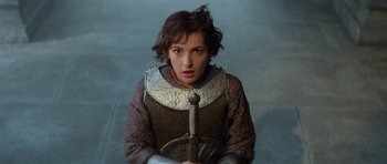 Movie still from “Bill & Ted's Excellent Adventure” (1989), directed by Stephen Herek – A woman in a medieval outfit holding a sword; Close Up shot, High angle