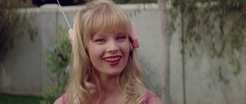 Movie still from “Bill & Ted's Excellent Adventure” (1989), directed by Stephen Herek – A woman with a pink bow in her hair; Close Up shot, Low angle