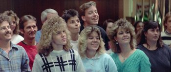 Movie still from “Bill & Ted's Excellent Adventure” (1989), directed by Stephen Herek – A group of young people standing next to each other; Close Up shot, High angle