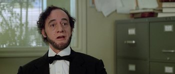 Movie still from “Bill & Ted's Excellent Adventure” (1989), directed by Stephen Herek – A man in a suit and a bow tie; Close Up shot, Low angle