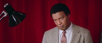 Movie still from “Bill & Ted's Excellent Adventure” (1989), directed by Stephen Herek – A man in a suit and a tie; Close Up shot, High angle