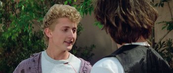 Movie still from “Bill & Ted's Excellent Adventure” (1989), directed by Stephen Herek – Two young men talking to each other in a park setting; Close Up shot, Over the shoulder angle