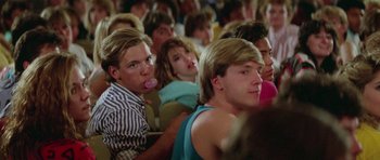 Movie still from “Bill & Ted's Excellent Adventure” (1989), directed by Stephen Herek – A group of people sitting in front of each other; Medium shot, Over the shoulder angle