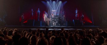 Movie still from “Bill & Ted's Excellent Adventure” (1989), directed by Stephen Herek – A crowd of people watching a man play a piano; Extreme Wide shot, High angle