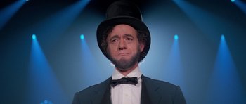 Movie still from “Bill & Ted's Excellent Adventure” (1989), directed by Stephen Herek – A man in a suit and a top hat; Close Up shot, Low angle