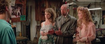 Movie still from “Bill & Ted's Excellent Adventure” (1989), directed by Stephen Herek – An older man and a young woman standing next to each other; Medium shot, Over the shoulder angle