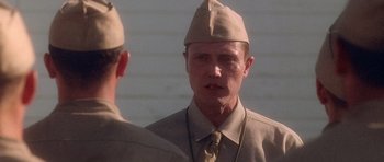 Movie still from “Biloxi Blues” (1988), directed by Mike Nichols – A man in a uniform is looking at himself in the mirror; Close Up shot, Over the shoulder angle