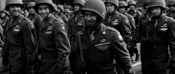 Movie still from “Biloxi Blues” (1988), directed by Mike Nichols – Black and white photograph of a group of men in uniform; Medium shot, High angle