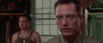 Movie still from “Biloxi Blues” (1988), directed by Mike Nichols – A person wearing a white shirt; Close Up shot, Over the shoulder angle