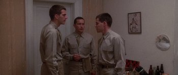 Movie still from “Biloxi Blues” (1988), directed by Mike Nichols – A group of young men standing next to each other; Medium shot, Low angle