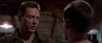 Movie still from “Biloxi Blues” (1988), directed by Mike Nichols – A man talking to another man in front of him; Close Up shot, Over the shoulder angle