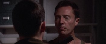 Movie still from “Biloxi Blues” (1988), directed by Mike Nichols – A person looking at a mirror; Close Up shot, Over the shoulder angle