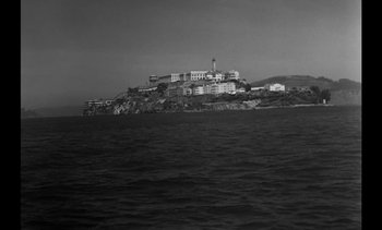 Movie still from “Birdman of Alcatraz” (1962), directed by John Frankenheimer – A black - and - white photo of alcatraz island; Extreme Wide shot, Low angle