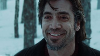 Movie still from “Biutiful” (2010), directed by Alejandro G. Iñárritu – A person smiling for the camera; Close Up shot, Over the shoulder angle