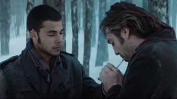 Movie still from “Biutiful” (2010), directed by Alejandro G. Iñárritu – Two men are looking at each other in the snow; Close Up shot, Over the shoulder angle