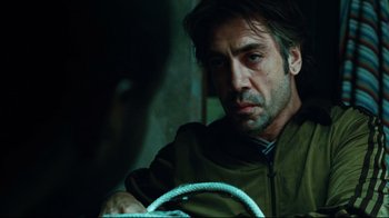 Movie still from “Biutiful” (2010), directed by Alejandro G. Iñárritu – A person sitting in a car; Close Up shot, Over the shoulder angle